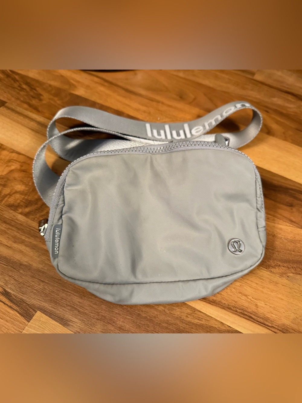 This is a Lululemon Everywhere Belt Bag 1L in the color Silver Drop logo belt